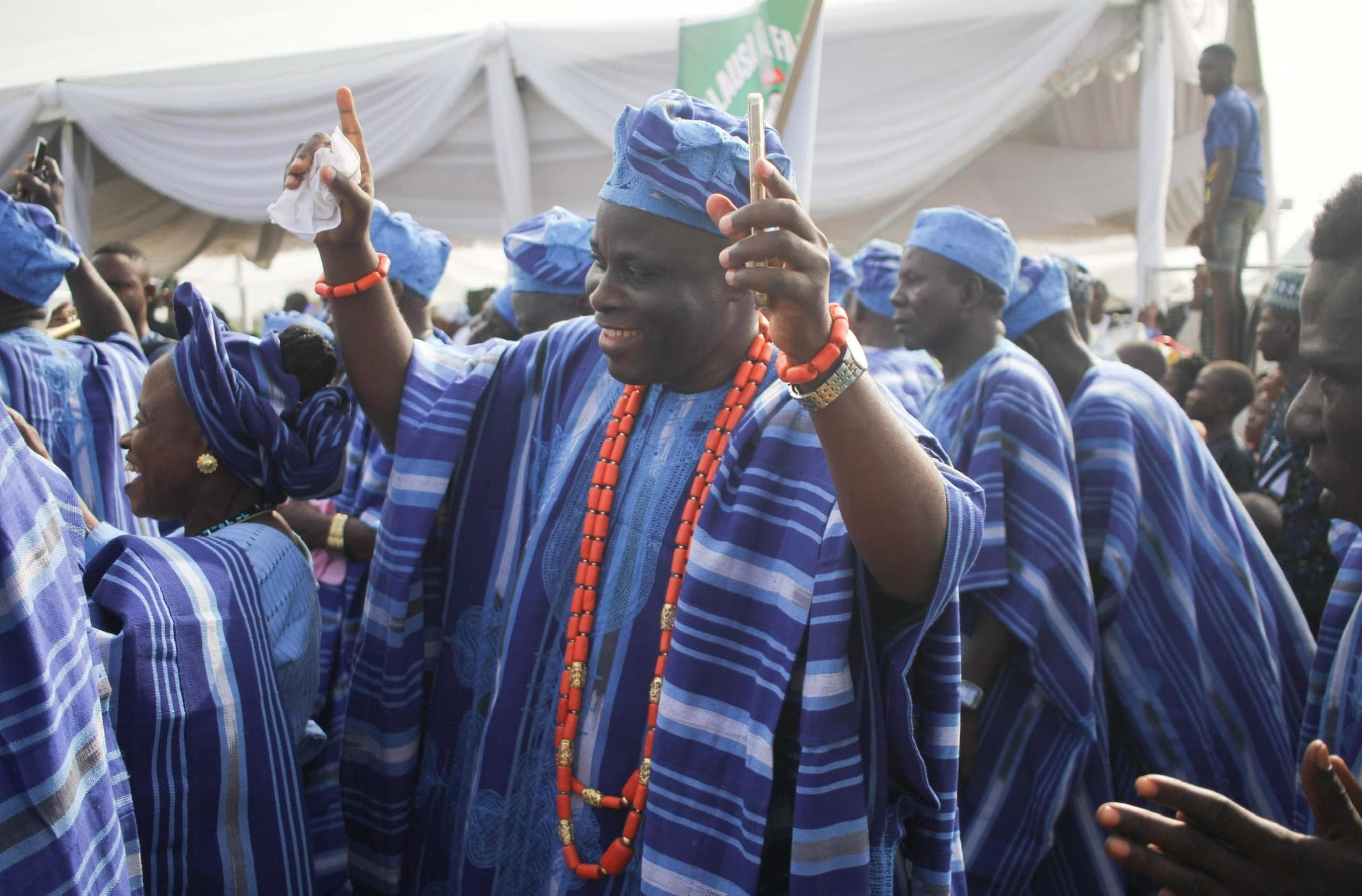 Comrade Ayeola in a sky-blue agbada during a public celebration